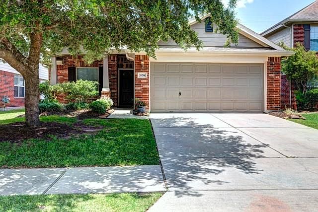 Coventry Home, with covered front patio and double wide driveway.