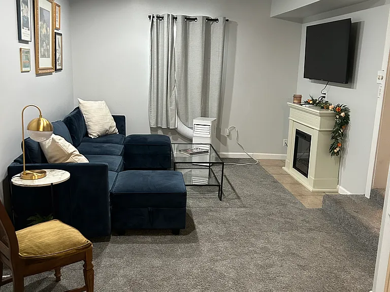 REC ROOM HAS A SECTIONAL WITH TABLES, TV AND FIREPLACE. GREAT PLACE TO SIT AND READ OR ENJOY A MOVIE.