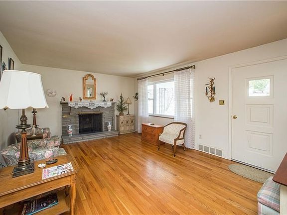 Another view of the main level living room and entry.  The huge picture window is newer and lets in so much natural light!