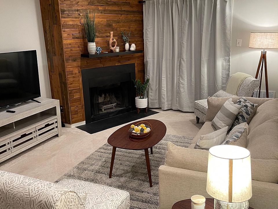 The living room is comfortably furnished with all new furnishings and accessories.