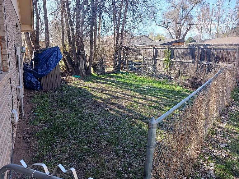Fully fenced yard for your garden/pup!