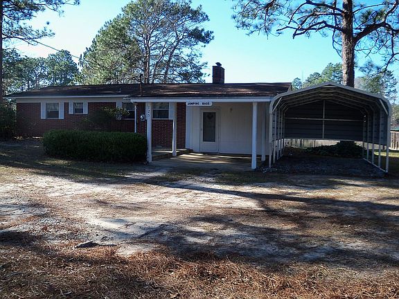 Front of house/2 carports
