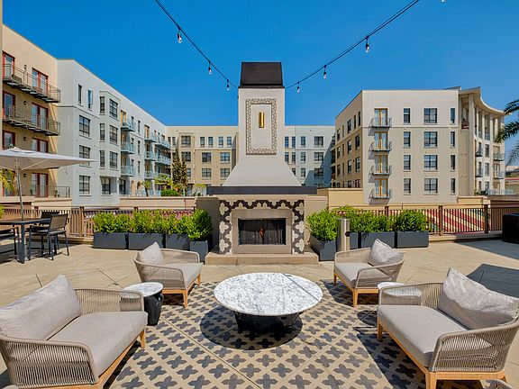 Outdoor fireplace with comfortable lounge area