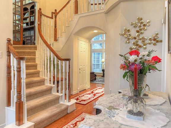 Another view of beautiful winding staircase in foyer