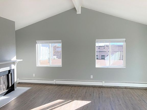 Living room with wood burning fireplace