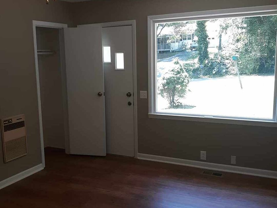 Living area with large front window.