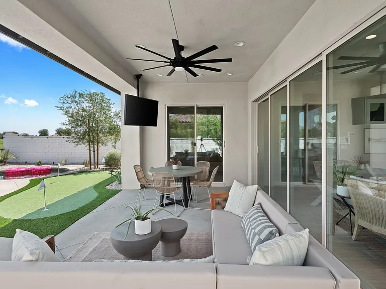The remote controlled ceiling fan outdoors will keep you cool.