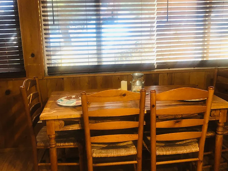 Dining table facing the beautiful mountain top. Wake up to beautiful sunrise and trees.
