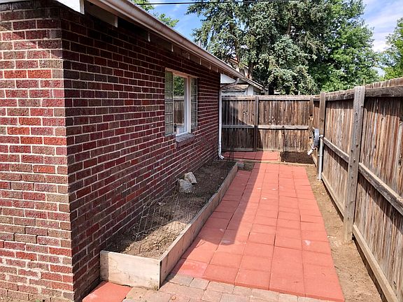 Side of House and Fenced in Patio and Lot
