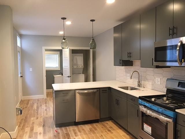 Modern Kitchen, view to laundry and 1/2 bath