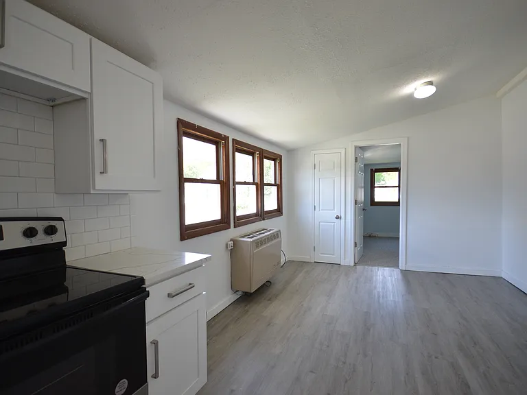 Dining area, door leads to Bedroom.