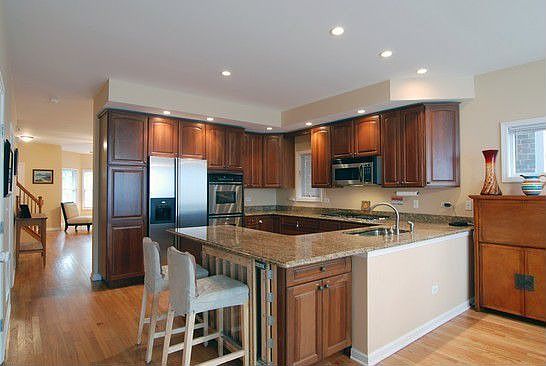 Cherry, stainless & granite kitchenb