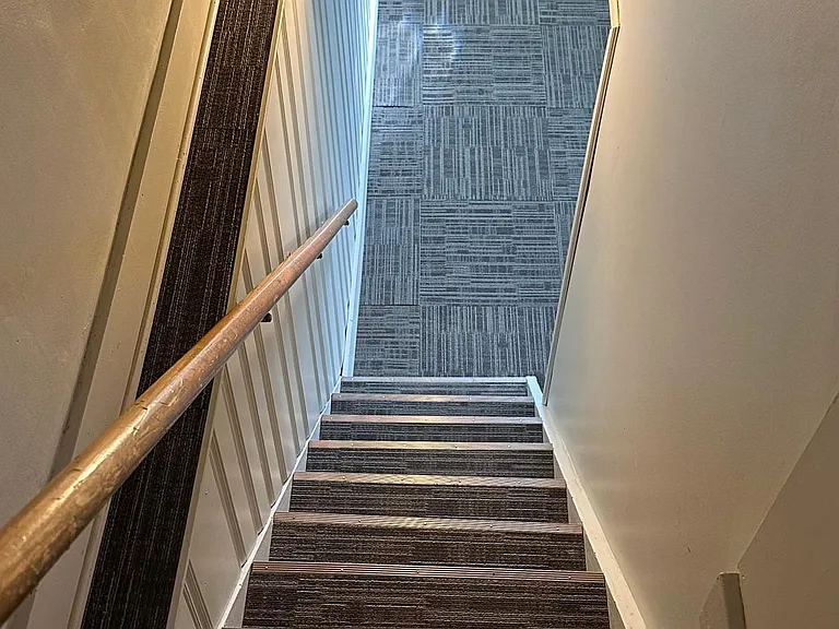 Stairwell to finished basement rec room