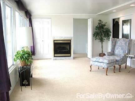 All Season Sunroom : Gas fireplace w/ doors on each side leading to a 13 x 5.5 rm w/windows,electr..