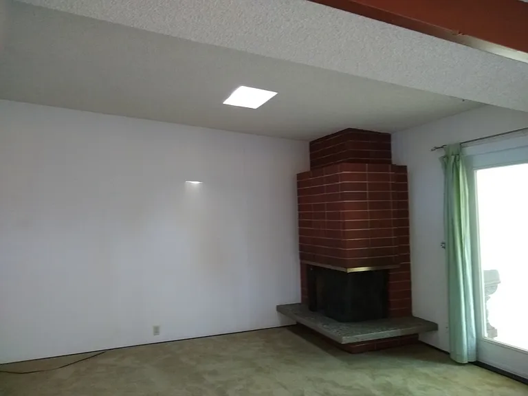 One end of living room and door to bonus room.