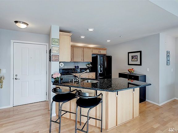 That's the entry to the left of the kitchen. The master suite is to the right.