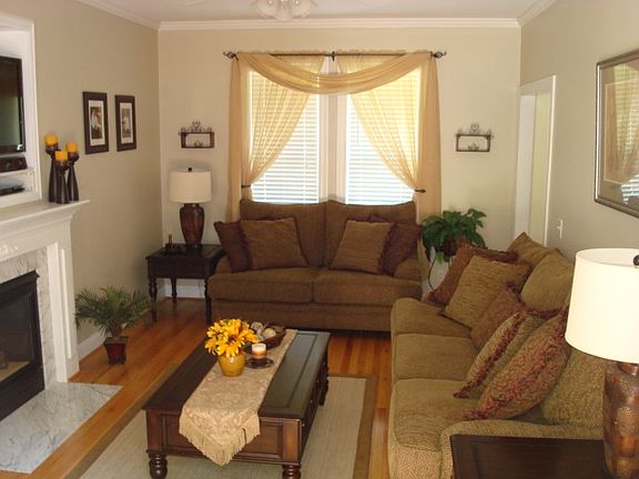 Living room with beautiful hardwood floor and fireplace. 