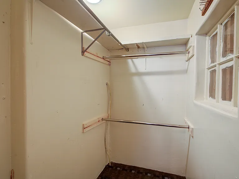 WALK IN CLOSET 8 X5 STORAGE CLOSET ACROSS FROM LAUNDRY ROOM