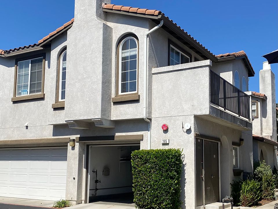 Exterior showing open garage