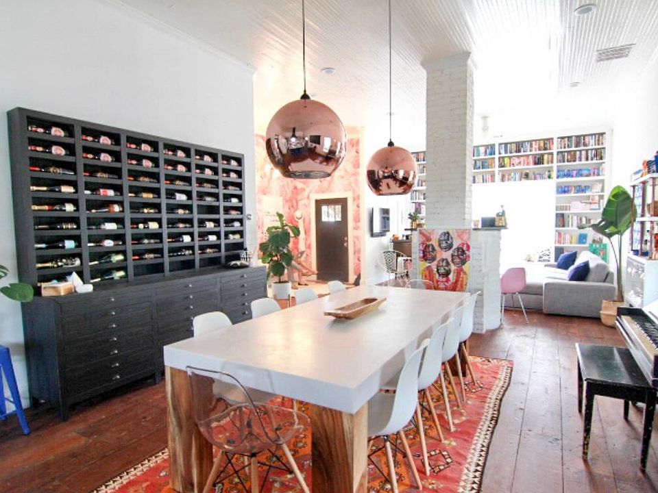 Open living, dining, and kitchen with 11 foot ceilings.