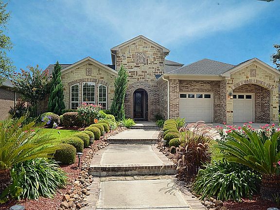 The exterior of this home has a commanding presence employing a 2-Story vertical element above the f