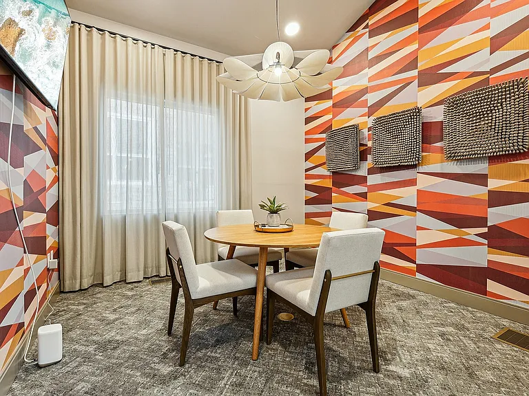 Experience dining in style with this chic and vibrant room, perfect for intimate gatherings.