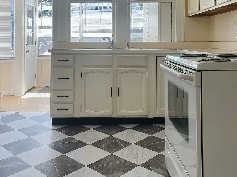 Kitchen leading to rear sunroom