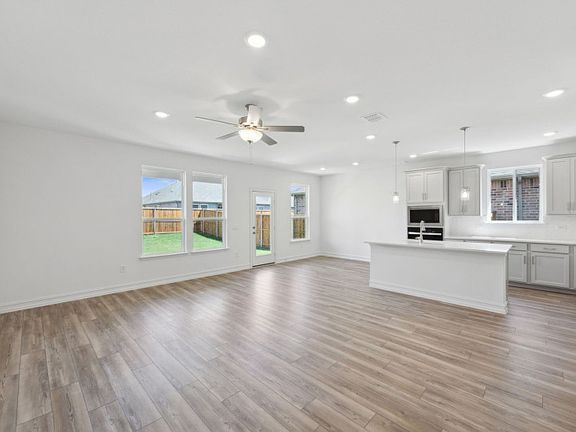 Airy kitchen with oversized island and ample cabinet space