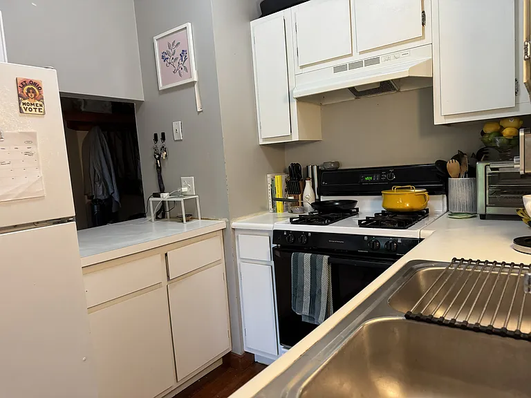 Kitchen with opening to entry