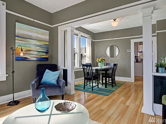 Formal living room leads to formal dining room & cozy kitchen. Large windows bring in light from all sides.