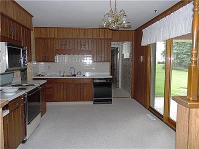 Kitchen view 1-newer Anderson patio doors opens to the carport/patio.