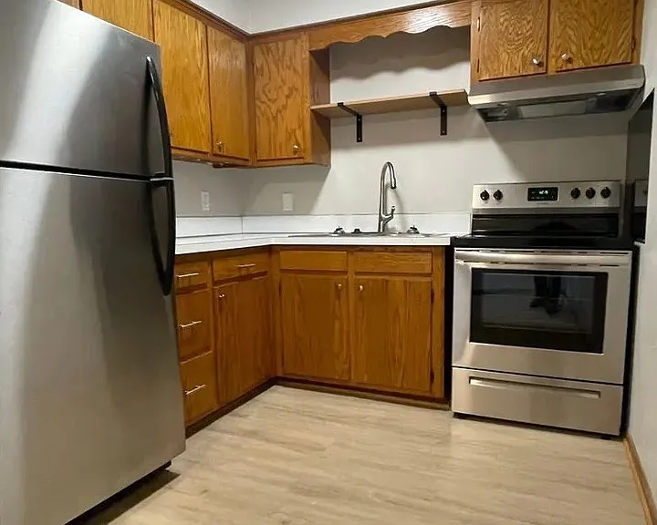 Elevate your culinary creations in this modern kitchen, featuring sleek stainless steel appliances and ample oak cabinetry. Perfect for hosting or enjoying solo meals. Come see the difference at LS Capital Groupa"schedule your visit today!