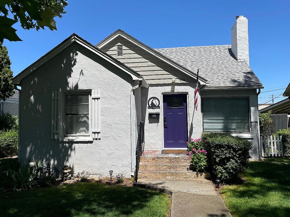 Upstairs unit with front of house entrance and a Coyote purple door.