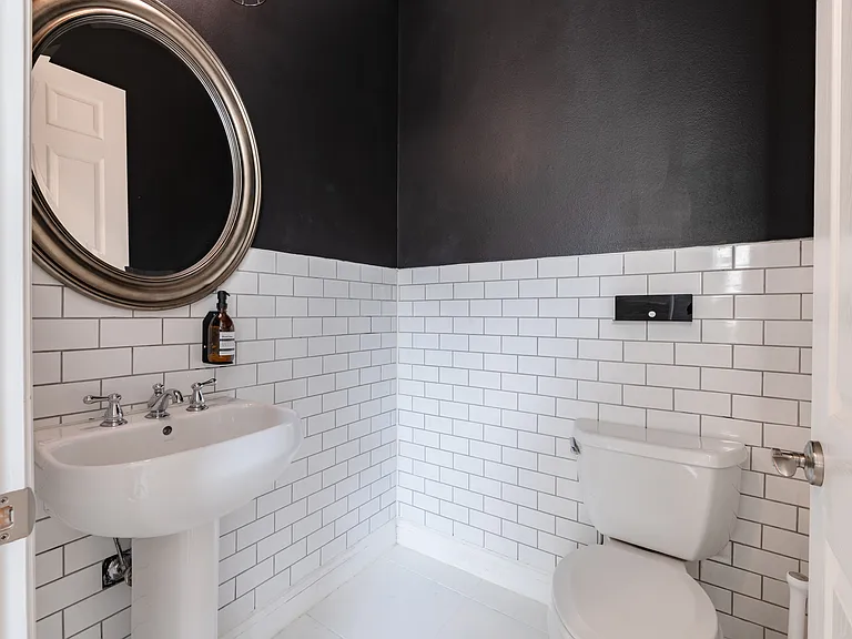 The remodeled half bathroom is downstairs, right off of the kitchen/ living area.