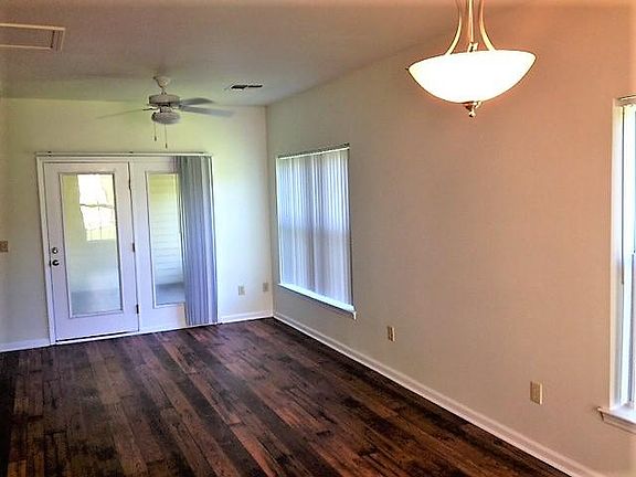 Living Room / Dining Room off Kitchen Opening to Screen Porc