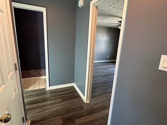 showing hall way bath and master bedroom.