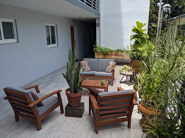 Deck in front of the apartment. The apt is the one showing in the picture (windows and door).