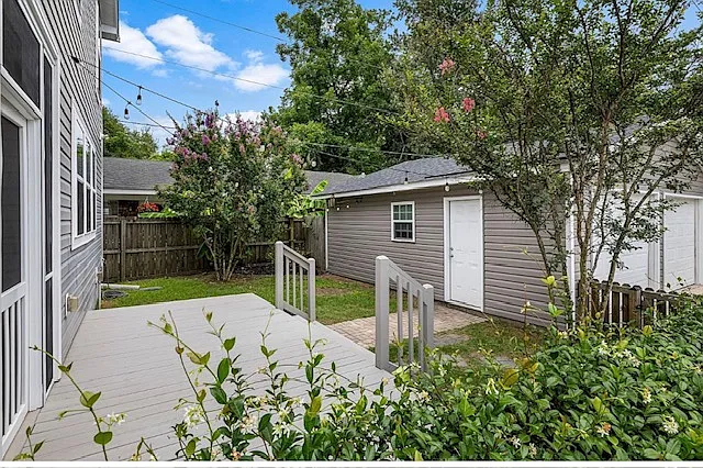 Quaint backyard with large deck off of screened-in porch