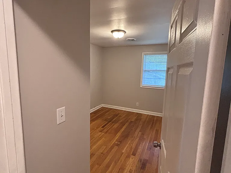 Back bedroom - view from hall.