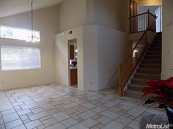 Formal living area and formal dining area with view towards second floor