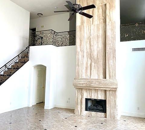 Family Room with Fireplace, and High Vaulted Ceilings..