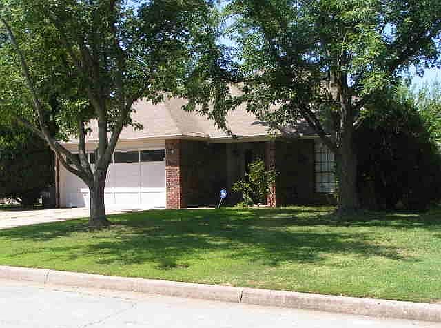 FRONT OF HOUSE, CORNER LOT, FENCED IN BACK YARD WITH COVERED PATIO