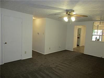 Living Room flows right into large Dining Room