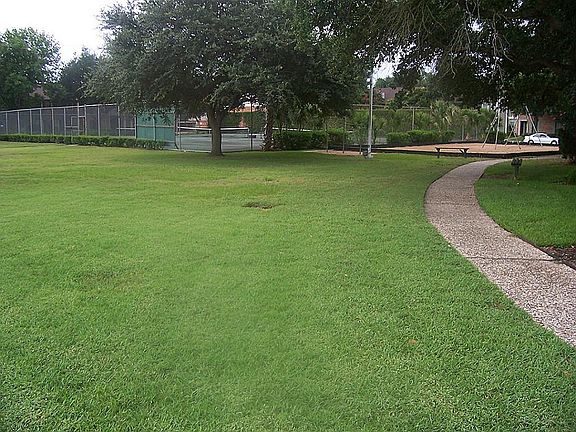 Across from a park, tennis & volleyball courts, and pool.