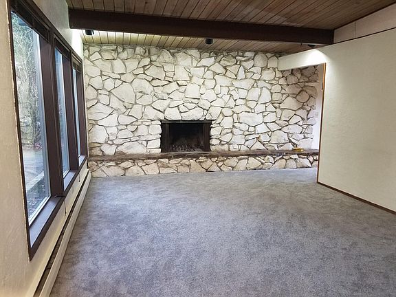 Living room with occasional use gas/wood fireplace
