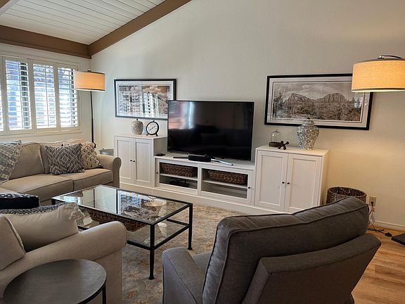 Large, bright living room with 52 inch TV