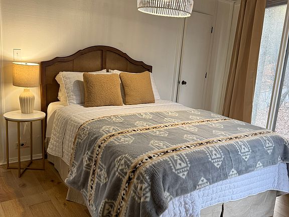 Master bedroom with queen bed and attached bath.