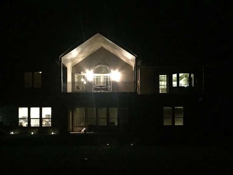 Evening photo of the walk-out 13x20 balcony (lighted).