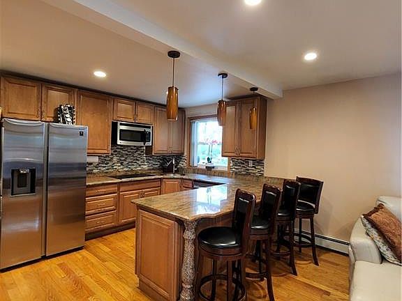 Kitchen with granite counters and Stainless Steel appliances, New S/S stove to be installed.