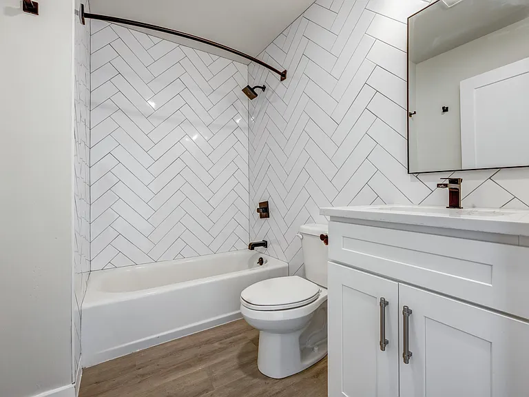 Welcome to Luckey Platt, where modern elegance meets functional design. Enjoy our beautifully crafted bathroom featuring a stylish herringbone tile and contemporary fixtures. Upgrade your lifestyle todayschedule a tour to see your new home!